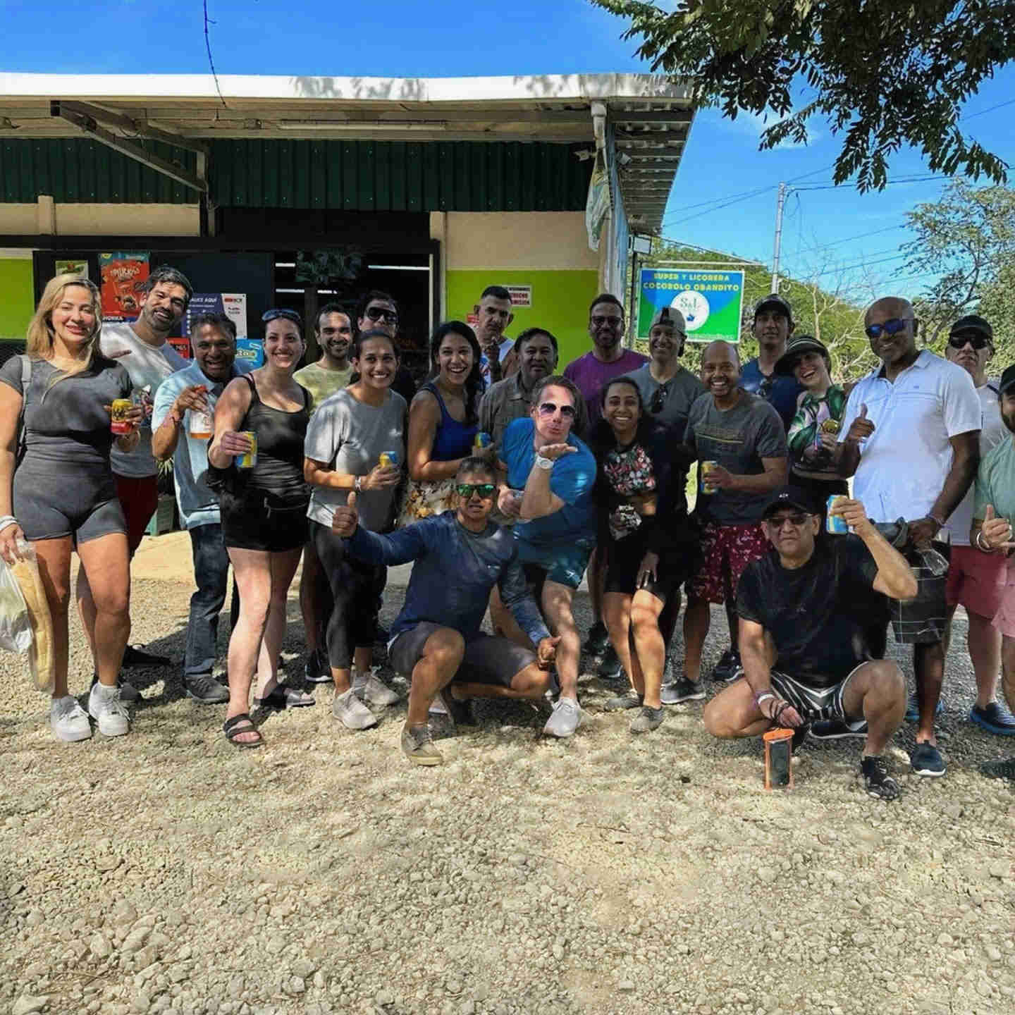 a wedding party group posing for a photo after an exciting zipline tour in costa rica 